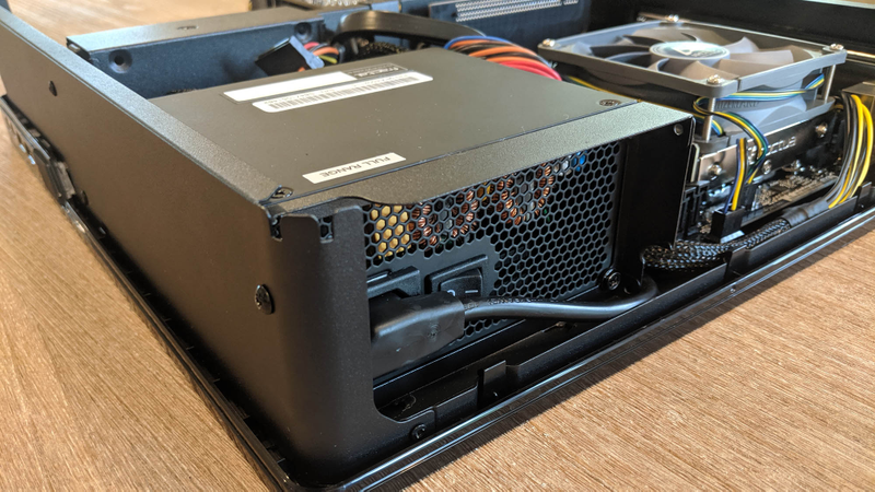 Some cases may route the power cord through the inside to save space on the rear panel.